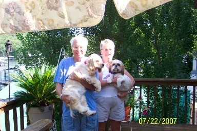 Gary and Judy Smith with their pets, Dolly and Samantha, at their home in Sunrise Beach MO.