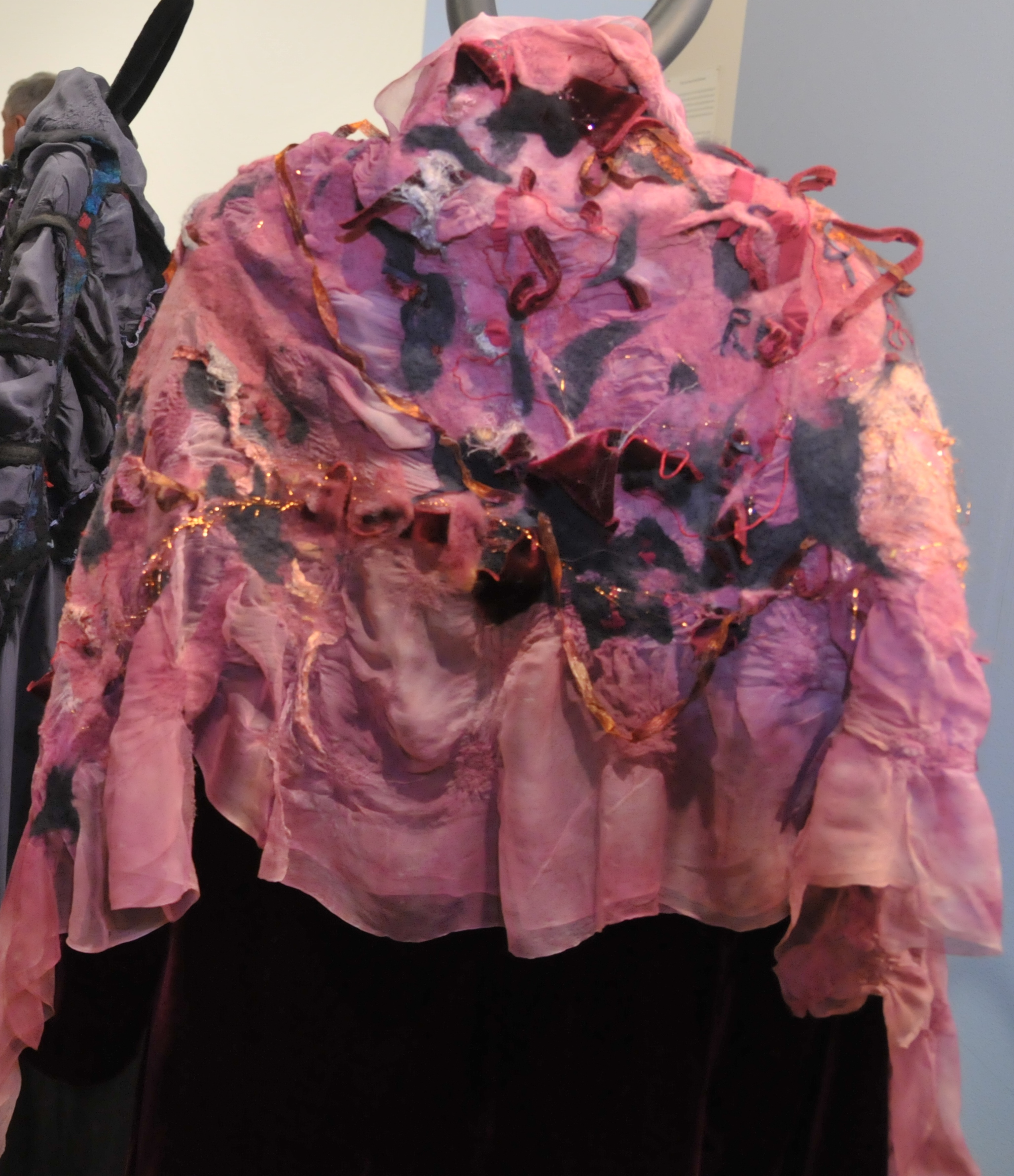 Detail of shoulder cloth in pink, wool and silk by Mary Sue Childers Foster, 2008
